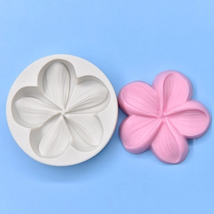 DIY five-petal plumeria flower silicone mold with a finished pink resin sample piece
