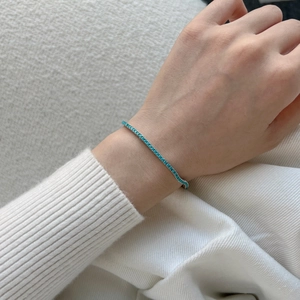 Elegant S925 sterling silver tennis bracelet with turquoise round stones on a female wrist