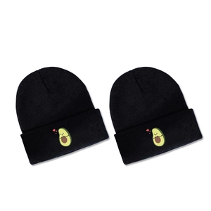 Set of two black knitted beanies featuring cute cartoon avocado embroidery and hearts