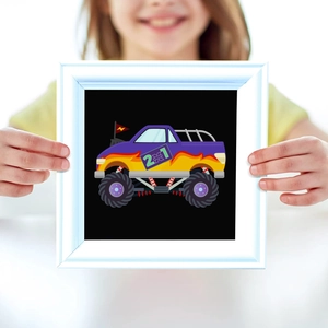 Kid holding a square frame with a purple monster truck illustration and fire decals