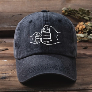 Vintage dark grey washed cotton baseball cap with fist bump embroidery for men and women