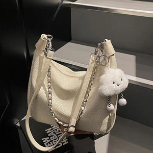 Chic cream crocodile pattern shoulder bag with metal chain and plush cloud charm