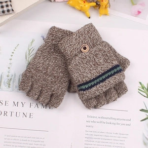 Detailed knit texture of brown variegated fingerless gloves with a decorative wood button