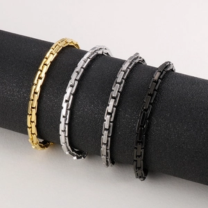 Detail of four square Byzantine chains in gold, silver, gun black, and black on a stand