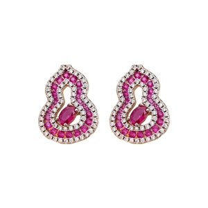 Rose gold hollow gourd earrings set with red and white zircons on a white background
