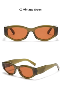 Detail view of vintage olive green polygon cat-eye sunglasses with translucent orange lenses