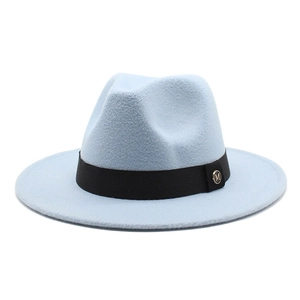 Close-up of light blue wool fedora hat with black ribbon and gold M logo emblem