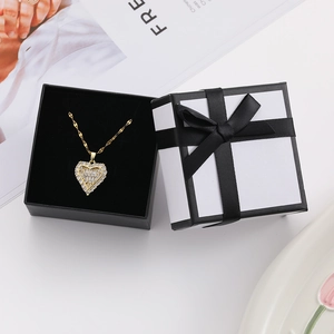 Exquisite gold heart pendant with pavé zircon in elegant gift box with black ribbon