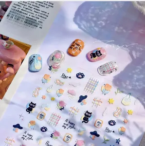 Detail of embossed Korean nail stickers with cat and tulip patterns for 3D manicure art