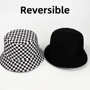 Reversible checkerboard bucket hat for sun protection in black and white pattern
