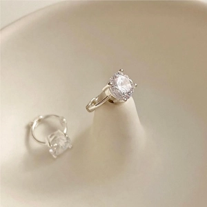 Minimalist 925 sterling silver four-prong stud earrings with round clear zircon stones