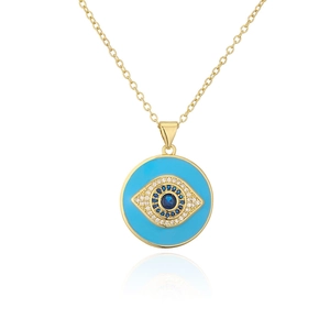 Close-up of 18K gold-plated Evil Eye pendant with blue enamel and sparkling zircons