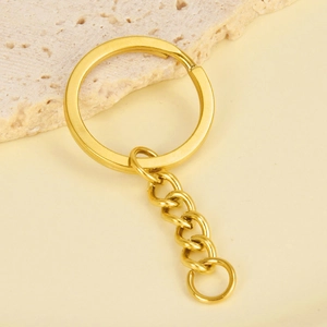 Close-up of 18K gold plated stainless steel flat key ring with short link chain