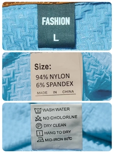 Detail of polo shirt collar label and wash tag showing 94% Nylon and 6% Spandex material