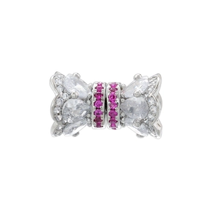 Macro view of bow charm with silver plating and micro-paved pink zircon details