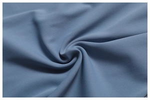 Macro detail of breathable blue yoga fabric texture with a soft flexible structure