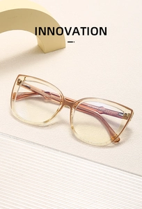 Detail view of champagne cat-eye glasses frame with 5747 size specs on the temple