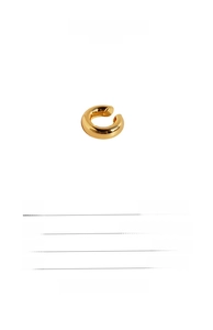 Macro detail of a 0.4cm wide 24k gold plated brass C-shaped smooth ear cuff on white background