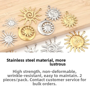 Macro detail of sun and moon stainless steel charms in gold and silver finish