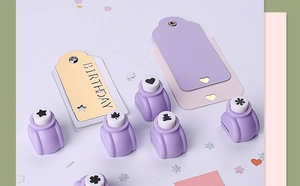 Detail showing various purple DIY paper punches with star, heart and snowflake patterns
