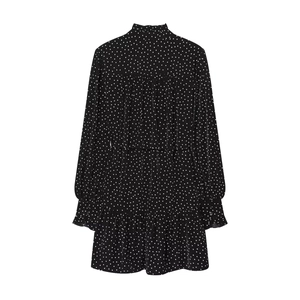 Flat lay of a black high-neck long-sleeve dress with white polka dot print and waist tie