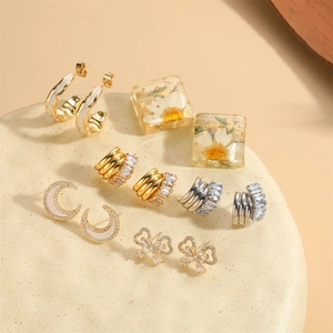 French vintage butterfly and crescent moon earrings set with dried flowers and zircons