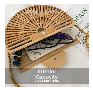 Top-down view of a semicircular bamboo bag showing spacious interior with daily essentials