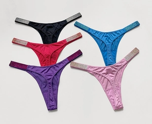 Detail view of five gradient color thongs with rhinestone side straps and satin texture