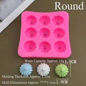 Detailed pink silicone mold with nine round ribbed cavities for chocolate or cake decorating