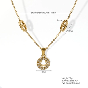 Close-up of gold 18K plated stainless steel necklace with diamond smile pendant