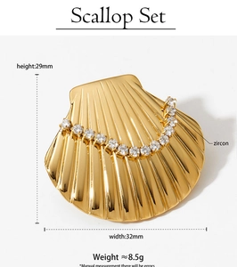 Detailed view of a gold fan-shaped zircon brooch with precise size and weight measurements