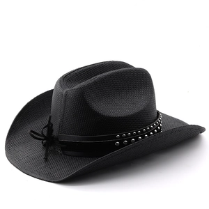 Detail of black straw cowboy hat with metallic rivets on a leather band and woven texture