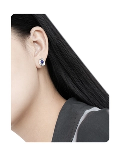 Detailed view of an oval lapis lazuli stone set in an irregular S925 silver stud earring