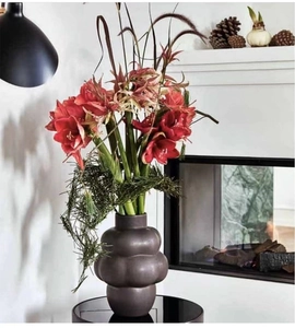 Detail of matte dark grey ceramic bubble vase with triple stacked sphere design for home