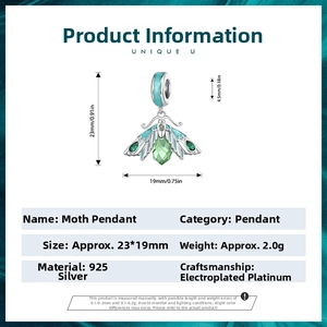 Detail of s925 silver moth pendant with green teardrop gem and teal enamel wings