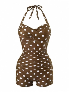 Detail of coffee brown polka dot one-piece swimsuit with halter neck and shirred bodice