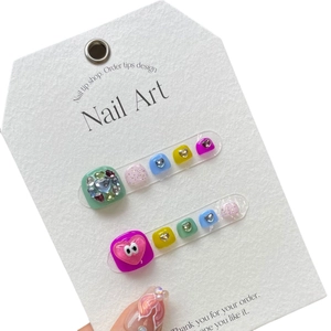 Colorful handmade press-on toenails featuring cute cartoon 3D eyes and glitter gems
