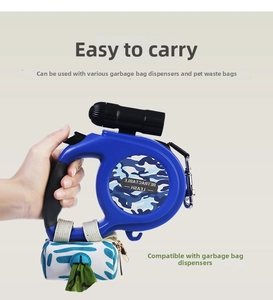 Blue retractable dog leash with integrated LED flashlight and waste bag dispenser