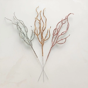 Close-up of sparkling gold, silver, and rose gold decorative branches for Christmas decor