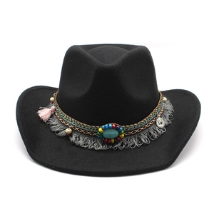 Detail of wool fedora with ethnic woven band, turquoise stone, beads and fringe