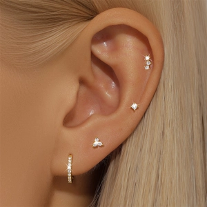 Macro shot of gold-plated S925 sterling silver geometric earring set with cubic zirconia