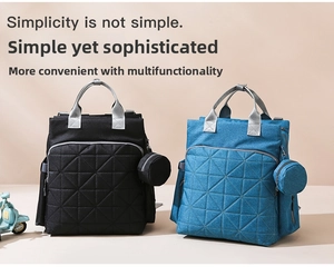 Front view of black and denim blue diaper bags with geometric stitching and small pouches