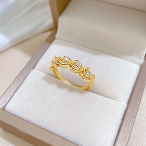 Golden heart-shaped double-row pavé diamond ring with adjustable open band design
