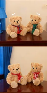 Detailed view of plush teddy bear set with festive plaid scarves in cozy home setting