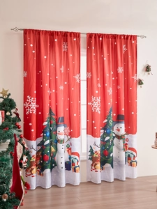 Detail of red Christmas snowman curtains with festive tree and gift box patterns
