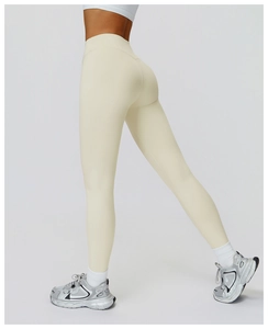 Detail shot of cream high waisted yoga leggings showing slimming fit and peach lift effect