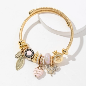 Adjustable gold stainless steel charm bracelet with pink heart, butterfly, and crown charms