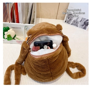 Internal storage detail of Capybara plush backpack with zipper and daily essentials