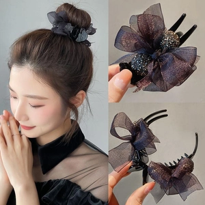 Close-up of sparkling mesh bow hair claw clip with rhinestones for elegant styling