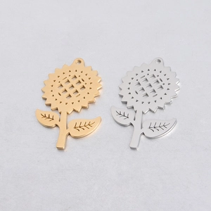 Detail of sunflower pendants in gold and silver finish for DIY jewelry making